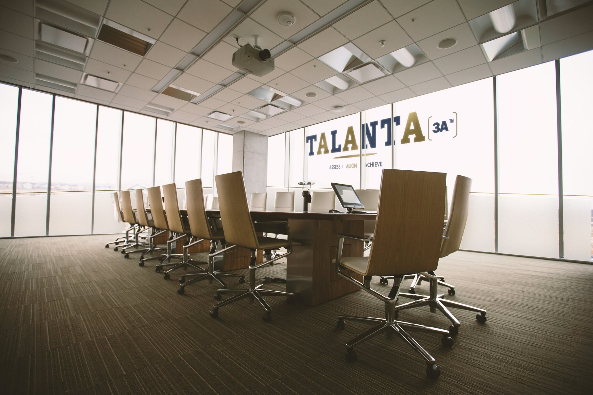 Boardroom with the TALANTA 3A logo painted on its glass wall